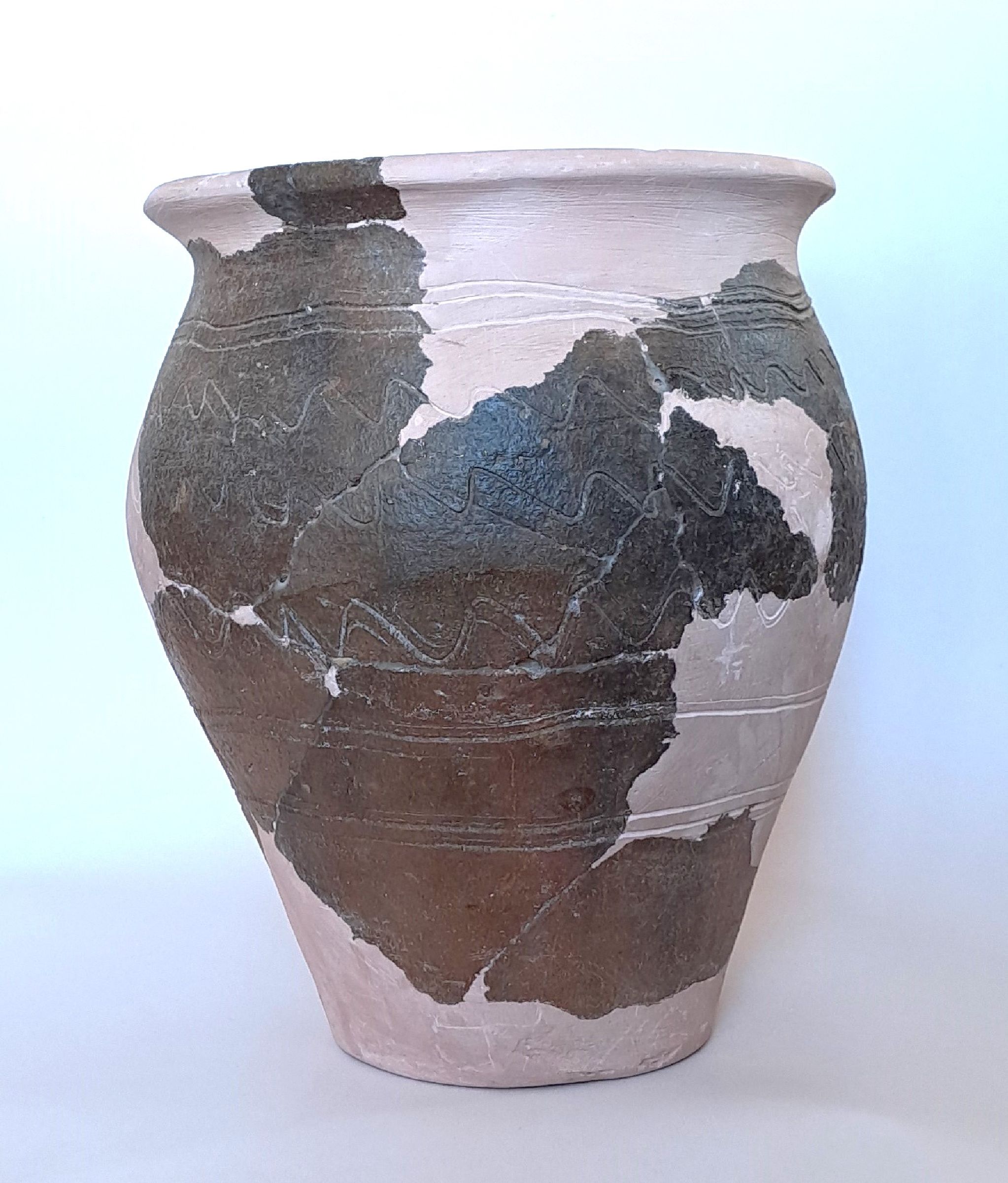 Ceramic vessel without handle, discovered broken and reassembled at museum